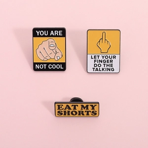 Three-piece yellow warning sign enamel pin set with Let Your Fingers Do The Talking text