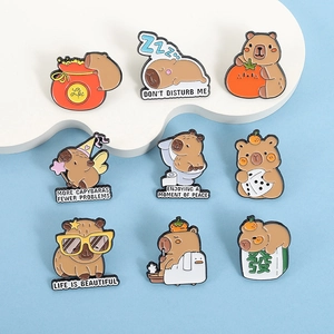 Set of cute cartoon capybara enamel pins with funny orange and mahjong accessories