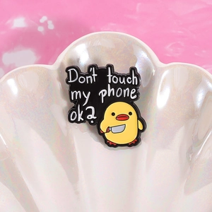 Funny yellow duck enamel pin with 'Don't touch my phone' text on shell tray