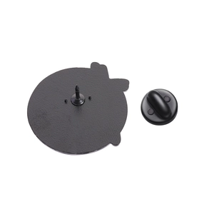 Detail of enamel pin back with metal needle and ergonomic black rubber clutch backings
