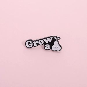Minimalist black and white enamel pin featuring a pear design and Grow a pear text