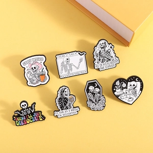 Funny skeleton enamel pins set featuring black and white skull badges for Halloween fashion