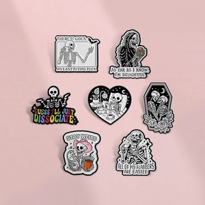 Set of 7 creative skeleton enamel pins featuring goth skull designs on a pink background