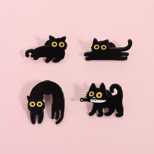 Set of four cute black cat enamel pins with yellow eyes in various funny poses