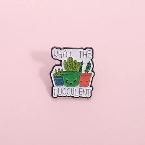 Cartoon plant enamel pin with three succulents and What The Fucculent text on pink background