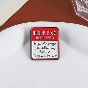 Red enamel pin featuring the classic Inigo Montoya quote on a HELLO name tag badge