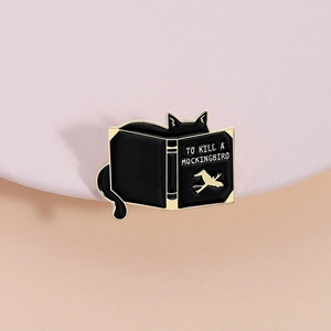 Enamel black cat and To Kill a Mockingbird book brooch with gold metal edges