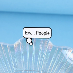 Minimalist enamel speech bubble pin with Ew People text on a decorative shell plate