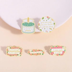 Set of 5 pastel enamel pins featuring motivational quotes with flowers and candles