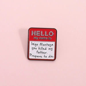 Creative red enamel name tag brooch featuring famous Inigo Montoya quote design
