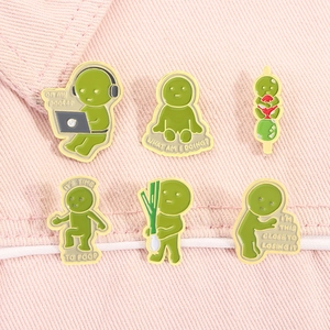 Sechser-Set kreative grüne Emaille-Pins mit lustigen Posen auf rosa Denim-Stoff