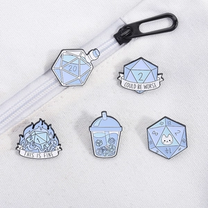 Detailed close-up of five blue enamel D20 dice pins with humorous slogans on canvas