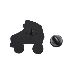 Back view of vintage roller skate enamel pin with a secure black rubber clutch fastener