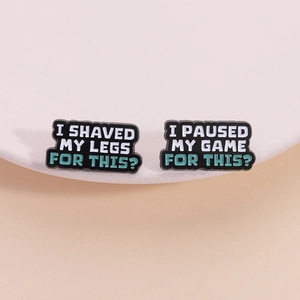 Funny slogan enamel pins set featuring I Shaved My Legs and I Paused My Game messages
