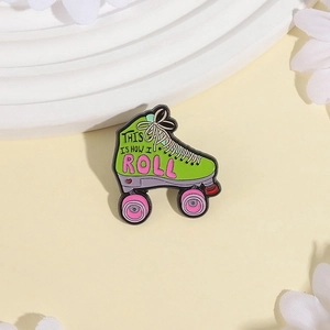 Creative green roller skate enamel pin with This Is How I Roll slogan on beige background