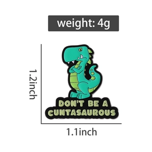 Detail view of a green dinosaur enamel pin with 1.1x1.2 inch dimensions and 4g weight