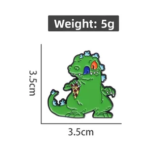 Detail view of cartoon dinosaur enamel pin showing dimensions 3.5cm and weight 5g