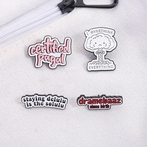 Set of 4 creative mental health enamel pins on a white canvas bag for outfit accessories