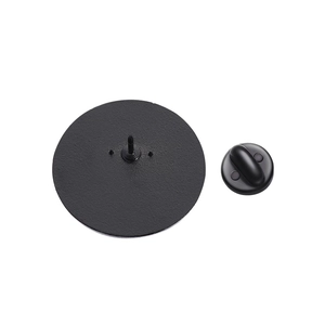 Macro detail of matte black alloy badge back with pin attachment and rubber clutch