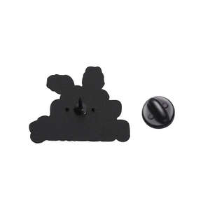 Detail view of the black metal brooch back with secure rubber clutch fastener