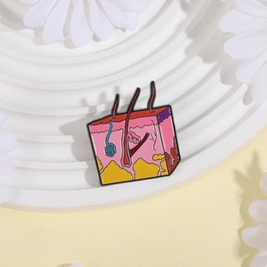 Cartoon skin layer enamel pin showing hair follicles on a bright decorative stand