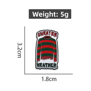 Macro view of red and green striped sweater enamel pin with 3.2cm size and 5g weight
