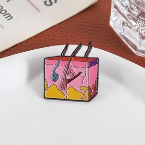 Detailed skin anatomy enamel brooch showing hair follicles and tissue layers on tray