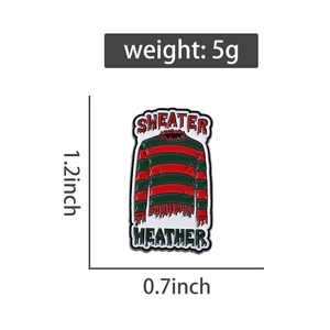Detail of horror movie striped sweater enamel pin with 1.2x0.7 inch size dimensions