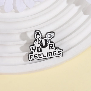 Minimalist black and white enamel matchstick man pin featuring YOUR FEELINGS text