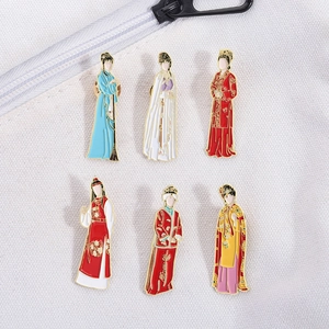 Detail of six Chinese style enamel pins set on a canvas fabric background with vivid colors