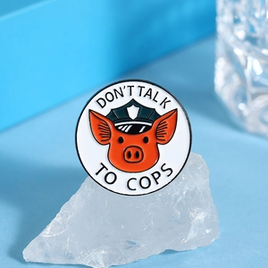 Cartoon pig policeman badge with Don't Talk to Cops text on blue background