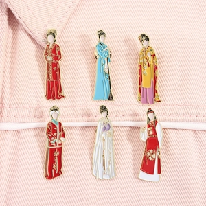 Set of six colorful enamel pins featuring traditional Chinese characters on pink denim