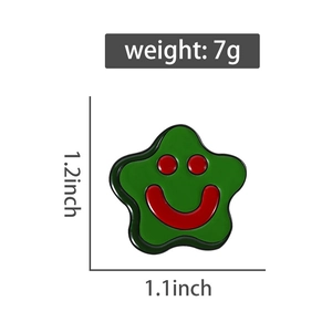 Detail of green star enamel pin showing size 1.2 by 1.1 inches and smooth glossy texture