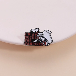 Gothic vampire enamel pin with red I'M A SUCKER FOR VAMPIRES text and white coffin