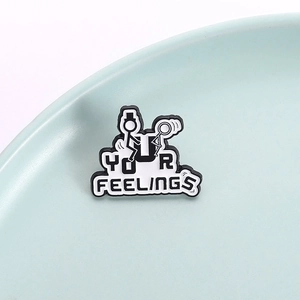 Stickman character metal badge with Your Feelings text in black and white finish