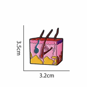 Détail de l'épingle anatomie de la peau montrant 3,5x3,2cm et un poids léger de 7g