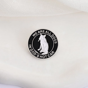 Détail d'un pin's rond en émail montrant un chien blanc et la phrase We are all dogs in God's hot car