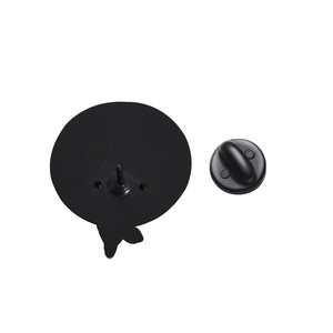 Detail of matte black metal brooch back with secure rubber clutch and sharp pin mount