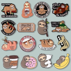 Detailed macro view of sixteen unique sloth enamel pins set on light green background