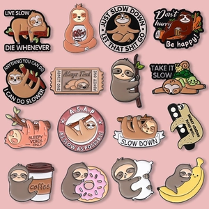 Close-up of cute cartoon sloth enamel pins collection in various creative designs