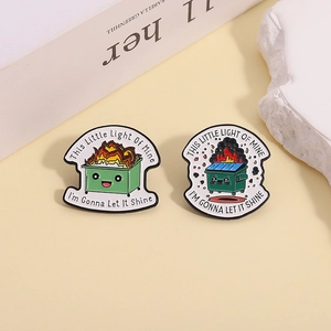 Cartoon green dumpster fire enamel pin set with inspirational quote on light background