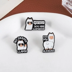 Three-piece cute alpaca enamel pin set with humorous quotes on white display tray