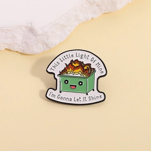 Cartoon dumpster fire enamel pin with motivational English quote and smiling face