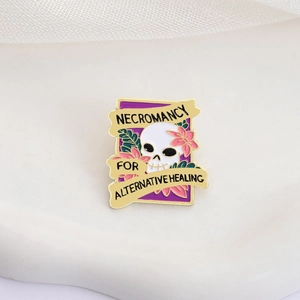 Skeleton skull enamel pin with pink flowers and Necromancy for Alternative Healing text