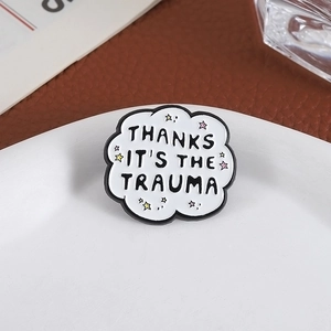 Cloud enamel pin featuring Thanks It's The Trauma quote and colorful stars decor