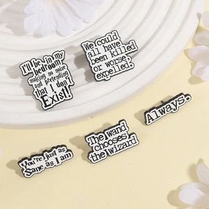 Five-piece Harry Potter enamel pins set with black and white movie quotes on display