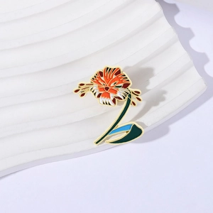 Artistic tiger lily enamel pin with orange floral tiger face design on white wavy board