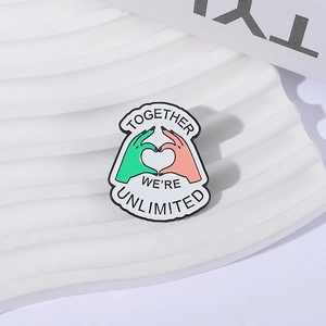 Modern enamel witch hand heart gesture brooch with Together We're Unlimited motto