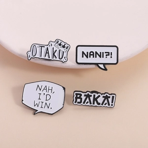 Set of four black and white enamel pins with otaku and baka anime text speech bubbles