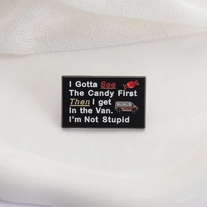 Black enamel rectangle brooch with funny quote I Gotta See The Candy First for backpacks